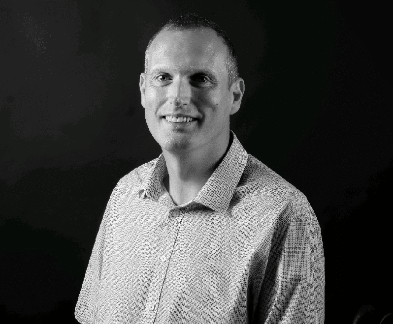 Black and white head shot of Stephen Glencross